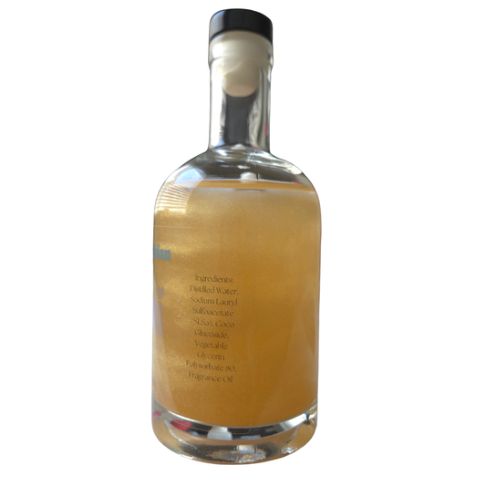 Clear bottle with yellow liquid on a white background