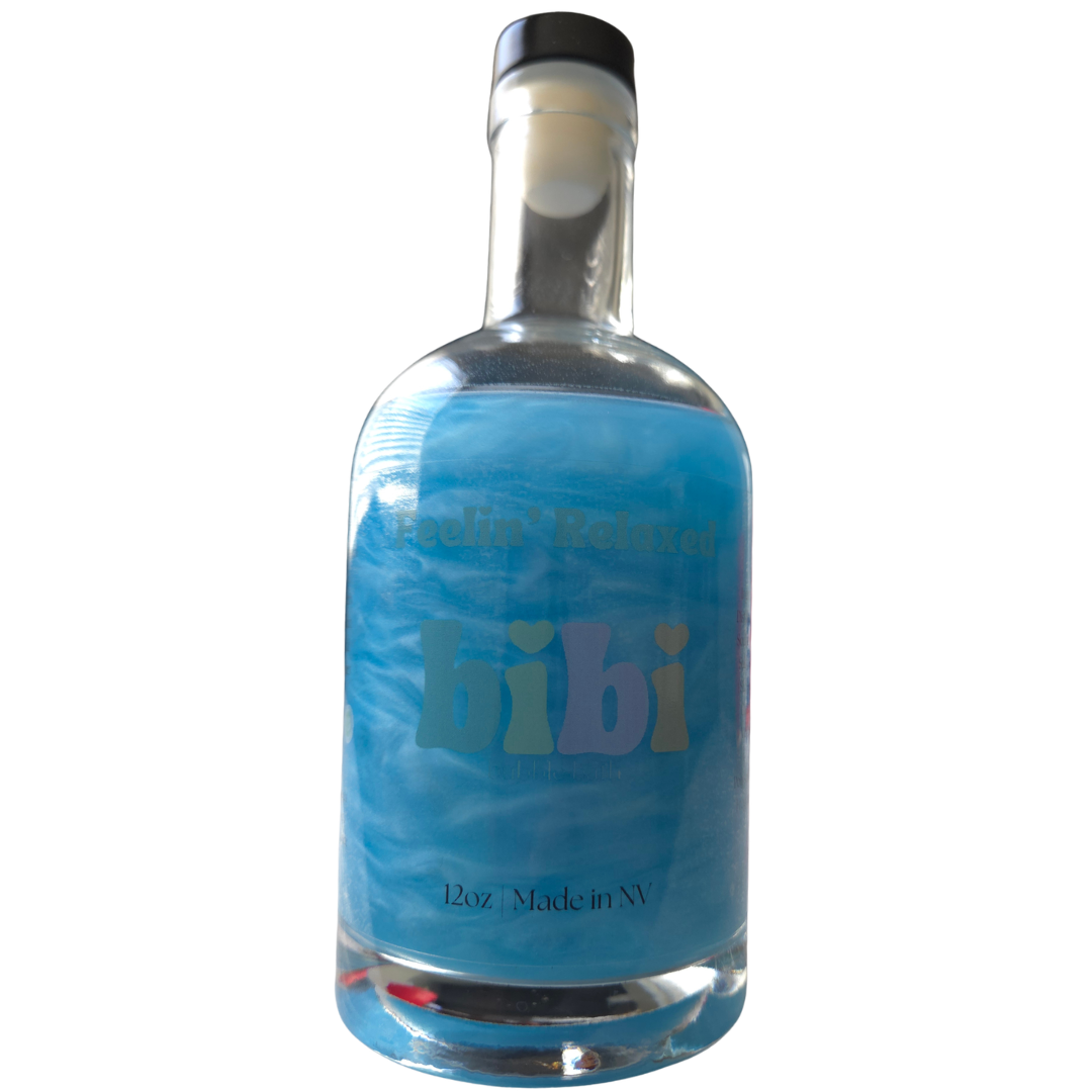 Bottle with blue label and black cap on a white background