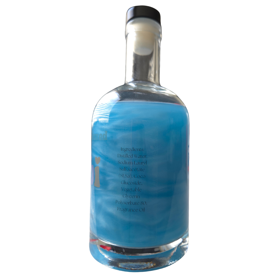 Clear glass bottle with a blue label on a white background