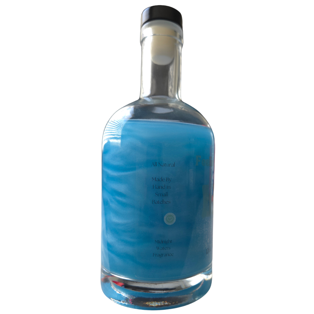 Clear glass bottle with blue label on a white background